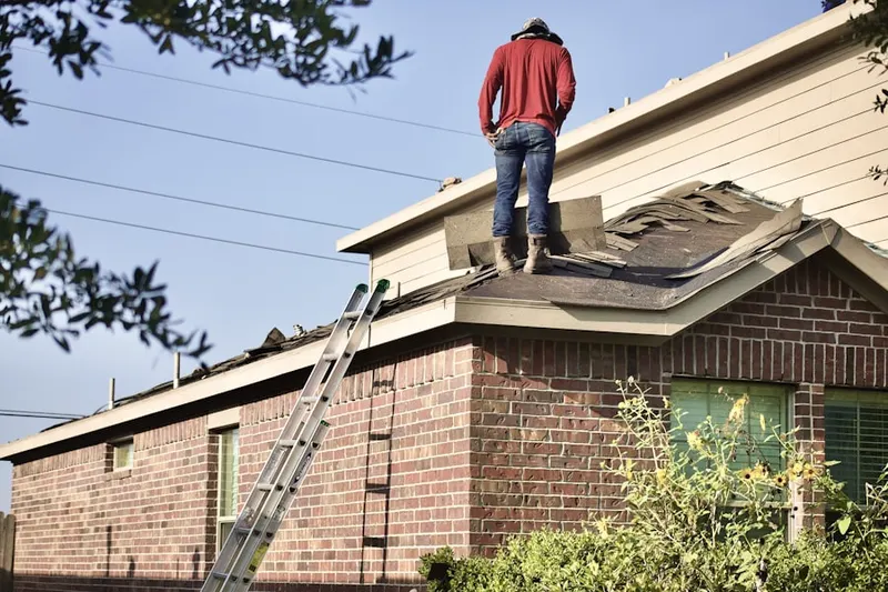 Professional roofer working on a residential roof in Lewisville Trails